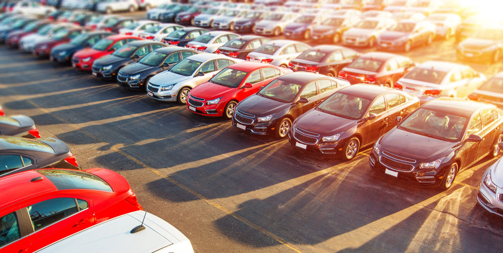 Lots of car brands in a parking lot