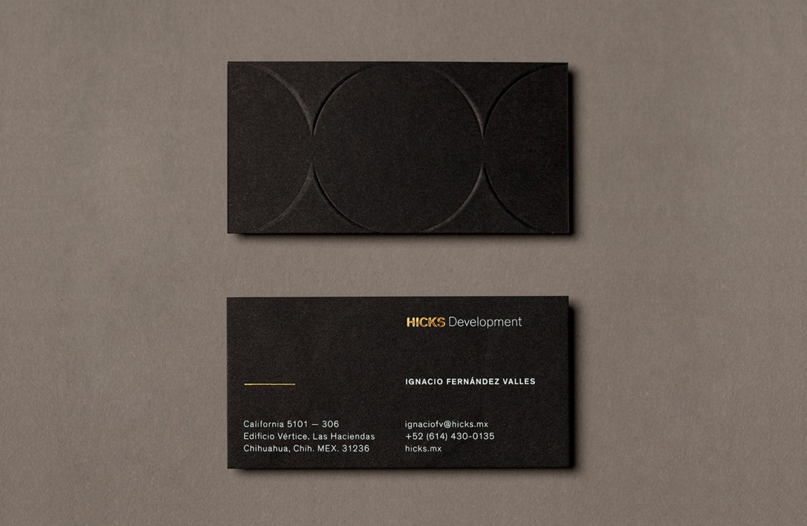 Brand identity and business cards with block foil and blind deboss detail designed by Face for Hicks Development.