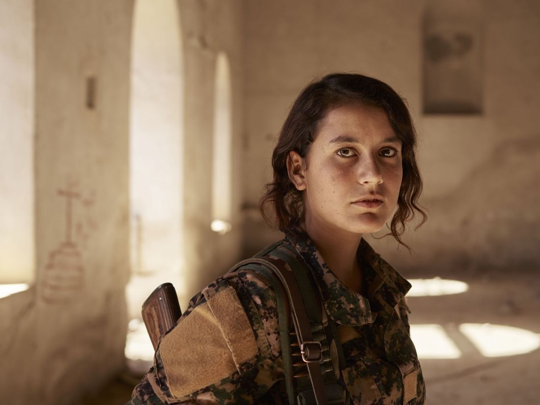 Perwîn, a volunteer YJÊ fighter, inside an abandoned Christian church. Shengal, Nineveh Governorate, Iraq, November 11, 2016. From [We Came From Fire​](​https://amzn.to/2L9l8Vm) by Joey L. – published by powerHouse Books