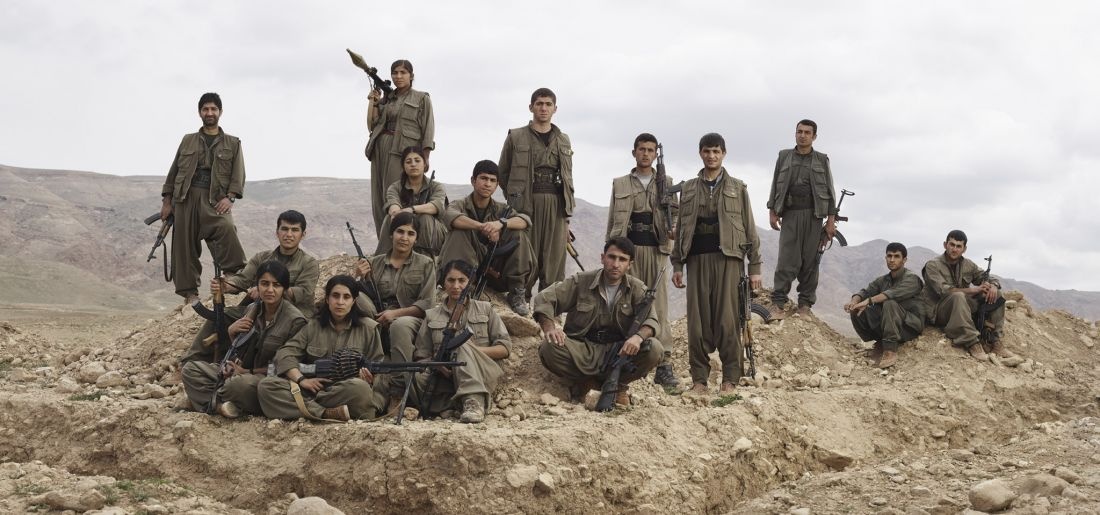 PKK guerrillas pose near their trench position outside Makhmur Refugee Camp. Makhmur, Erbil Governorate, Iraq, March 4, 2015. From [We Came From Fire​](​https://amzn.to/2L9l8Vm) by Joey L. – published by powerHouse Books