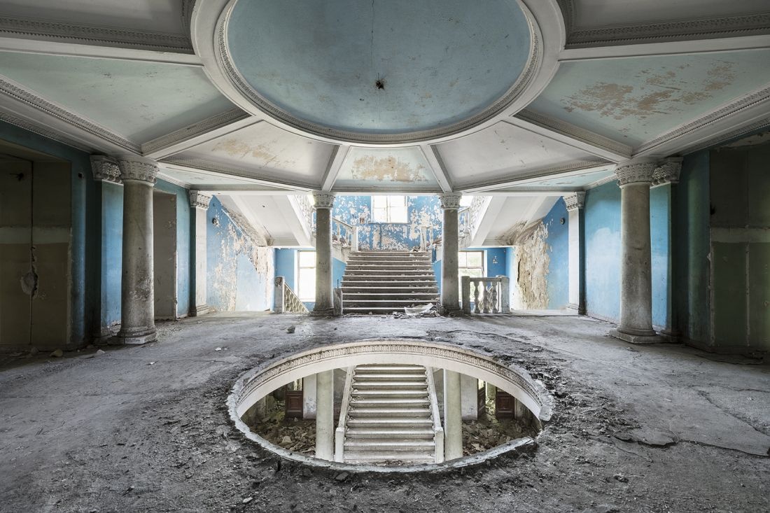 The view on the grand entrance hall inside a neglected sanatorium. This building will be redeveloped into a luxurious hotel. Tskaltubo, Georgia. © Reginald Van de Velde